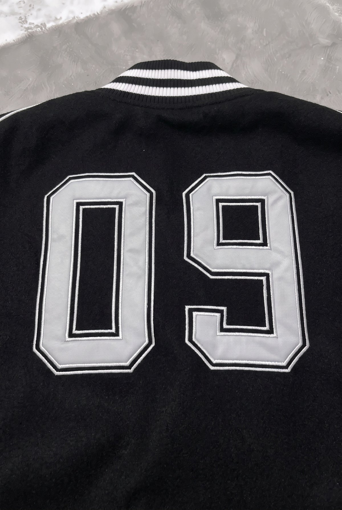 BALENCIAGA Political Campaign Varsity Jacket in Wool and Leather – Black – back 09 close-up