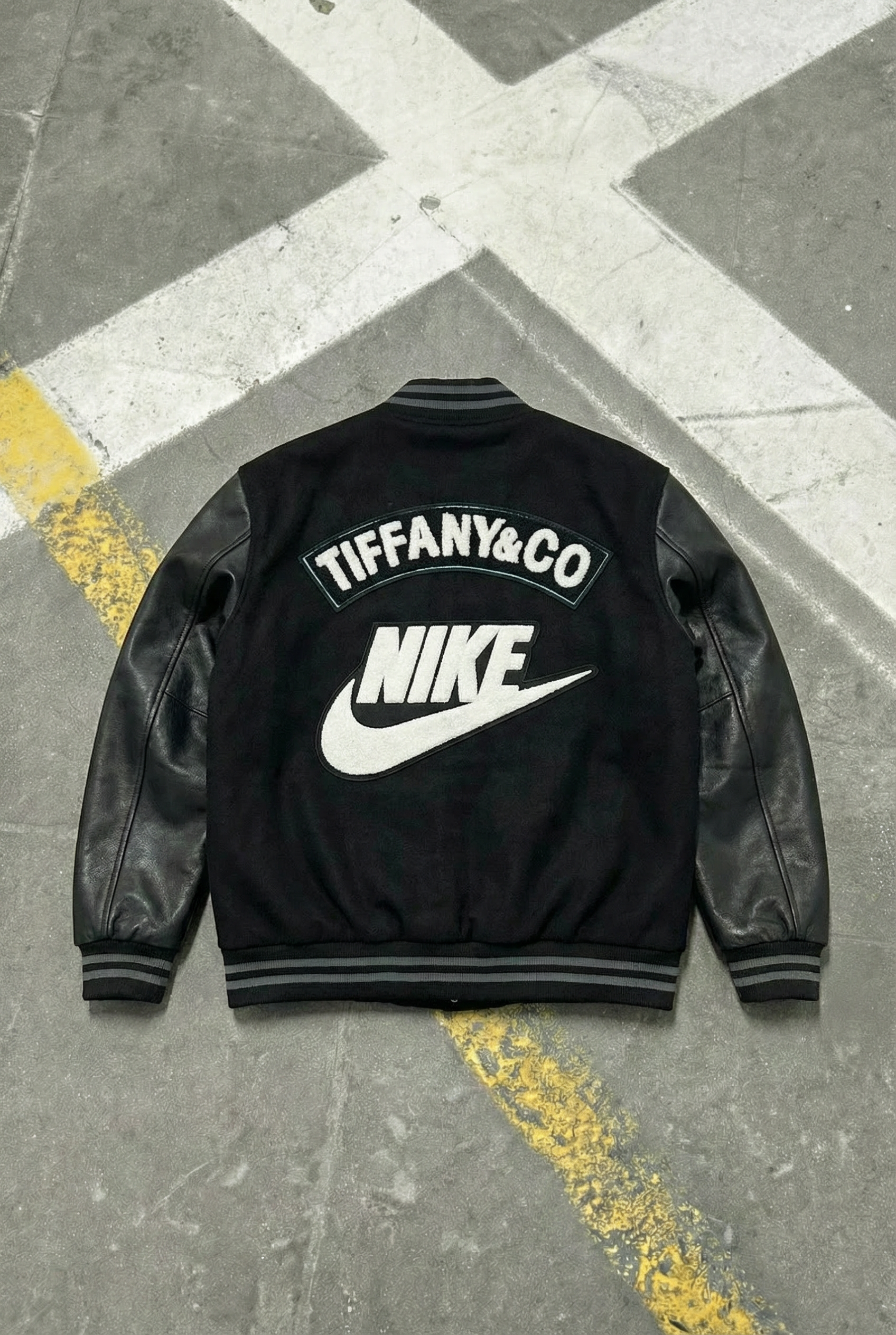 nike varsity jacket with leather sleeves