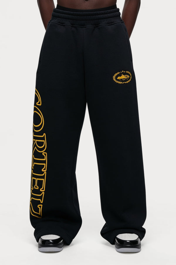 Corteiz Superior Royale Open Hem Pant - Black/Yellow, worn on model