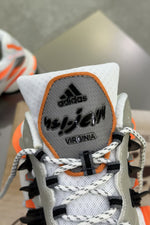 Pharrell Williams x Adidas Adistar Jellyfish – Focus Olive/Core Black/Orange – tongue with Virginia patch